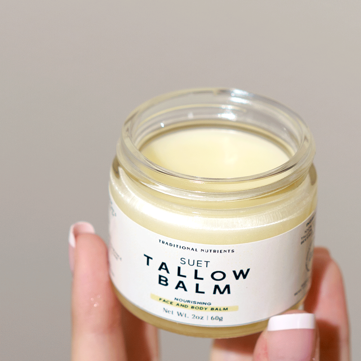 A close look at a scoop of Vanilla tallow balm from the jar